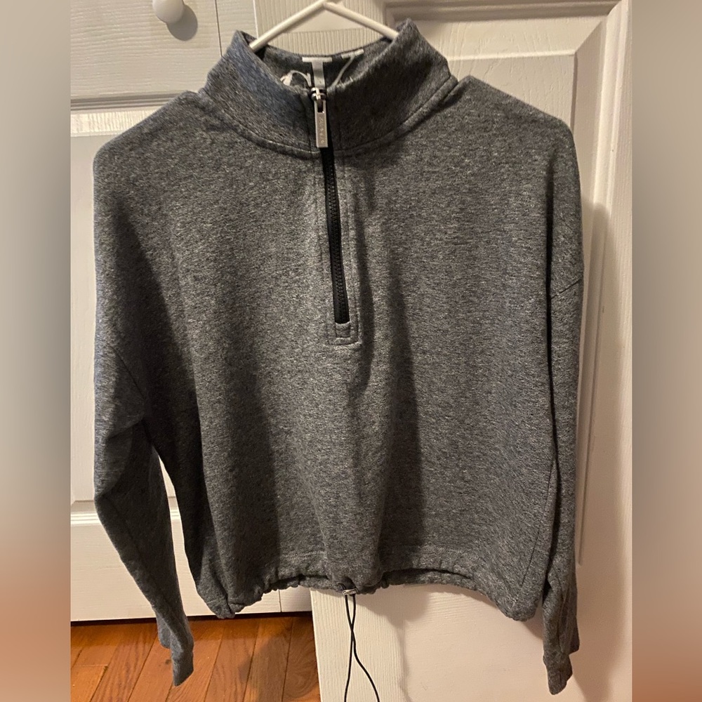 Two Calvin Klein crop top sweatshirts